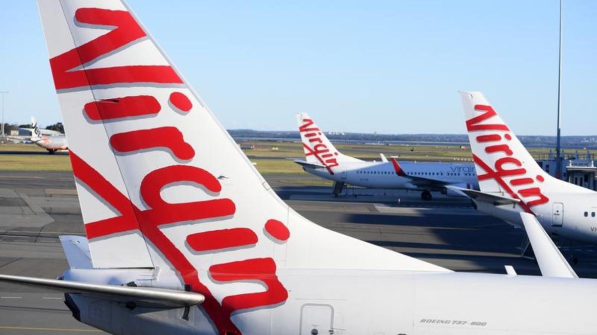 3 males gotten rid of from Virgin Australia flight by AFP at Darwin airport