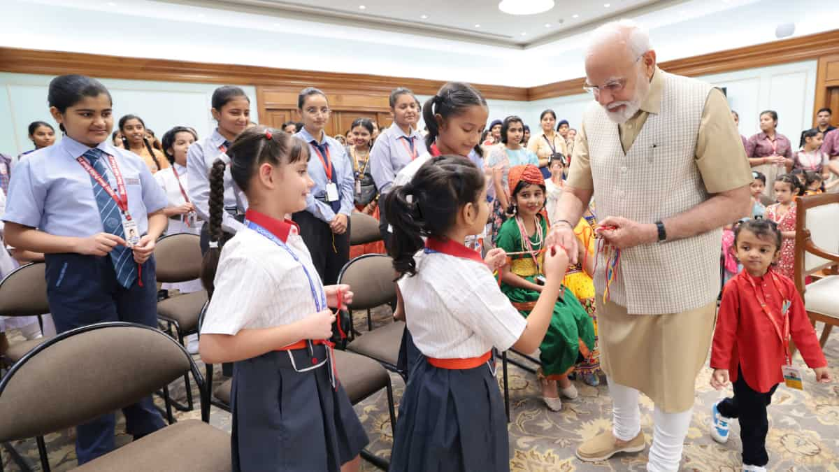 View: Indian PM Modi commemorates Rakshabandhan with young school child