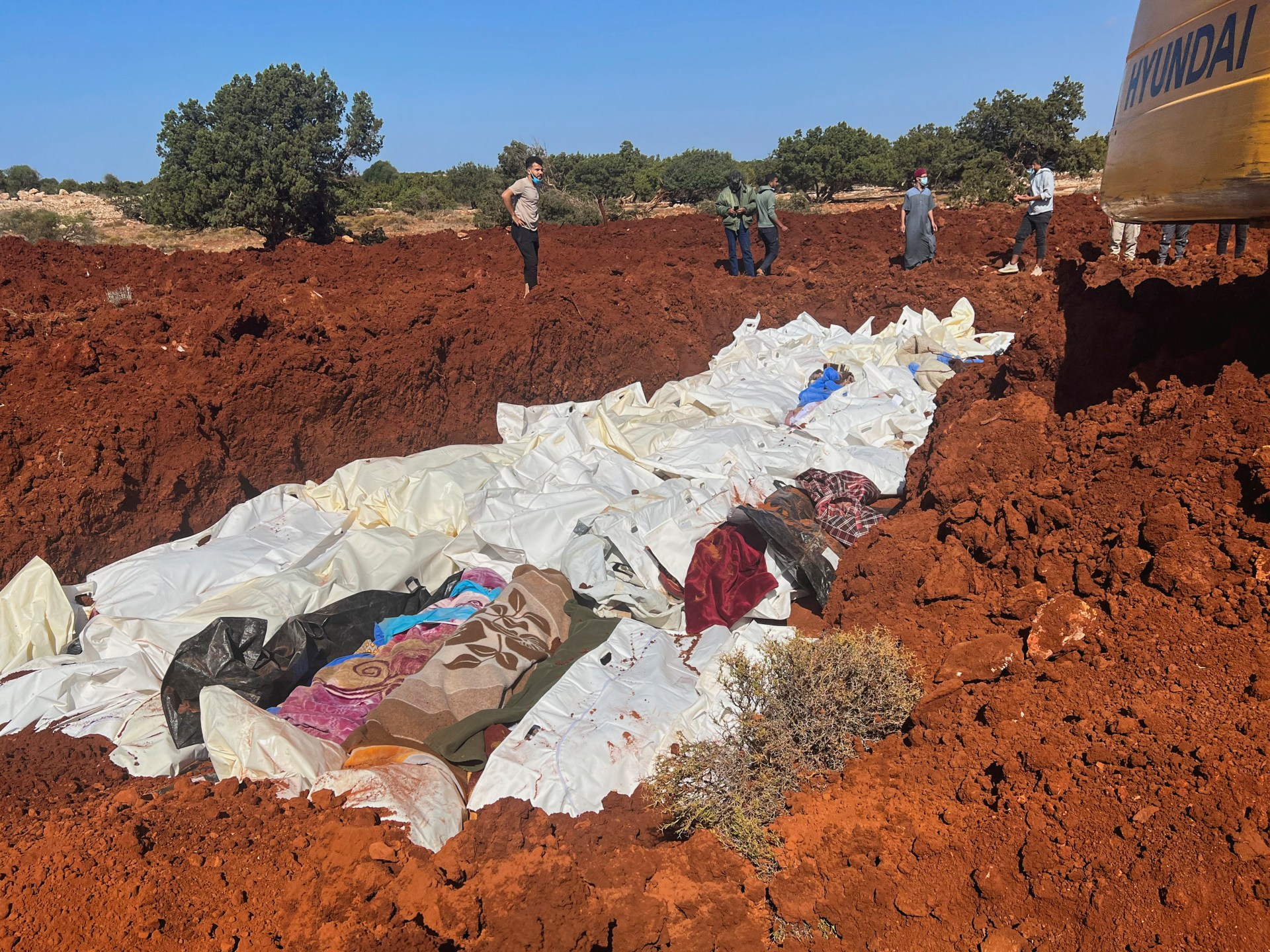 Hundreds buried in mass graves as Libya reels from ravaging flooding