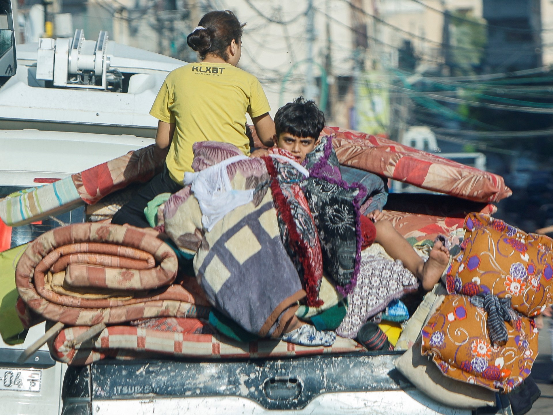 Palestinians leave their homes towards southern Gaza after Israeli order