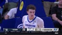 Creighton’s Ryan Kalkbrenner tapes a block then follows with a dunk on the other end vs. UConn