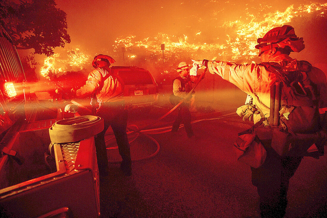 Residents flee fires and hunker down as winds pick up on Boxing Day scorcher