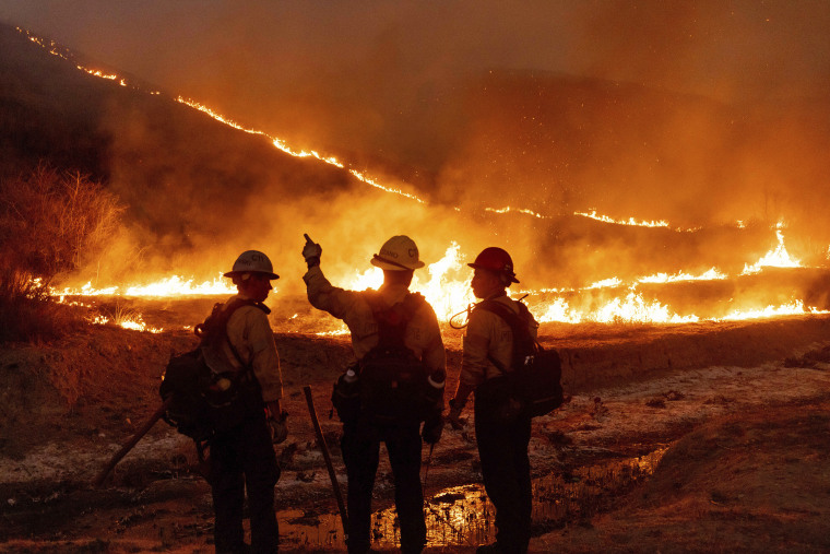 California fires: LA fire crews make progress as officials expect ‘much-needed break’ from dangerous weather – as it happened