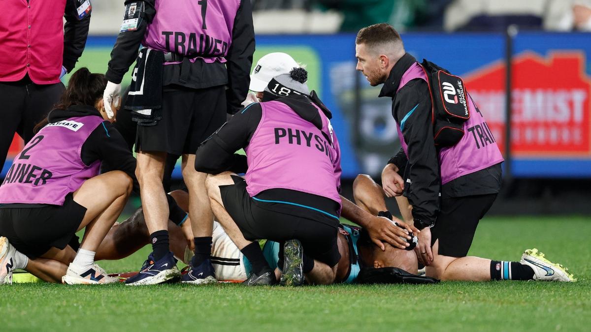 ‘Heartbreaking scenes’ as Port Adelaide veteran Esava Ratugolea suffers knee injury in ‘best game of his career’