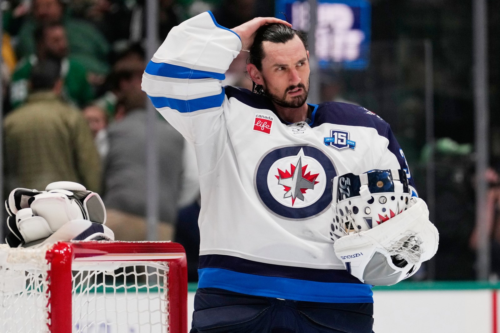Jets suspend goalie Connor Hellebuyck for failing to report to training camp